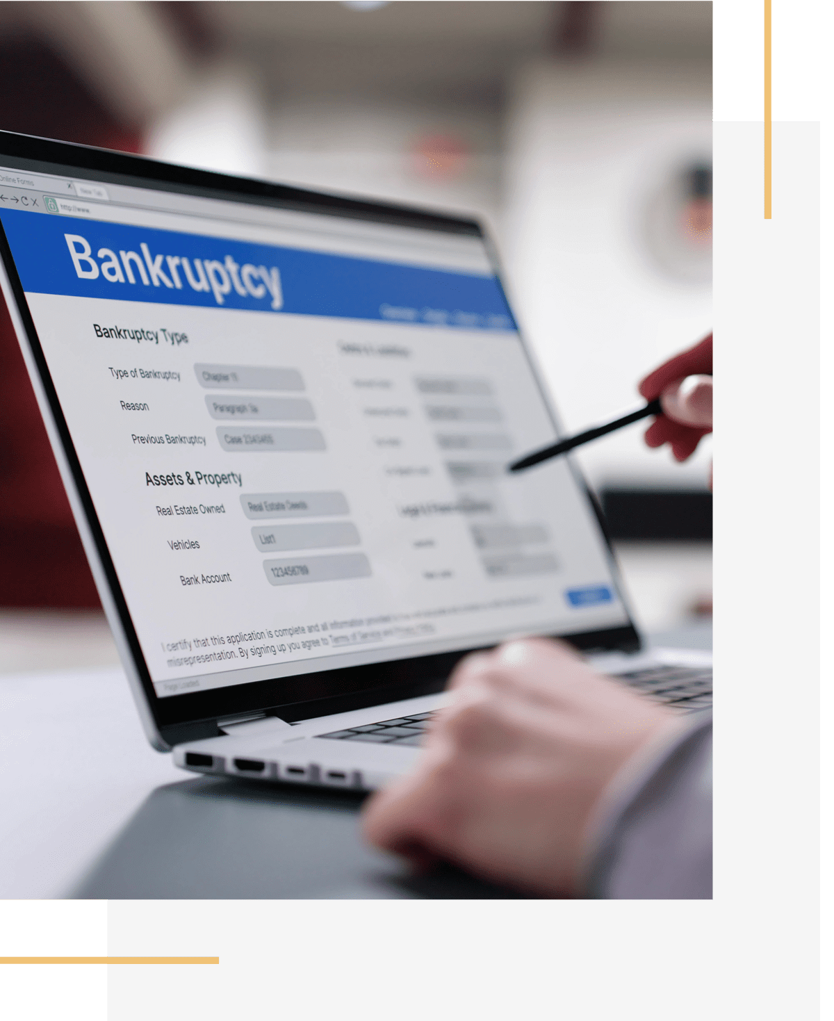 Hand holding pen near bankruptcy information