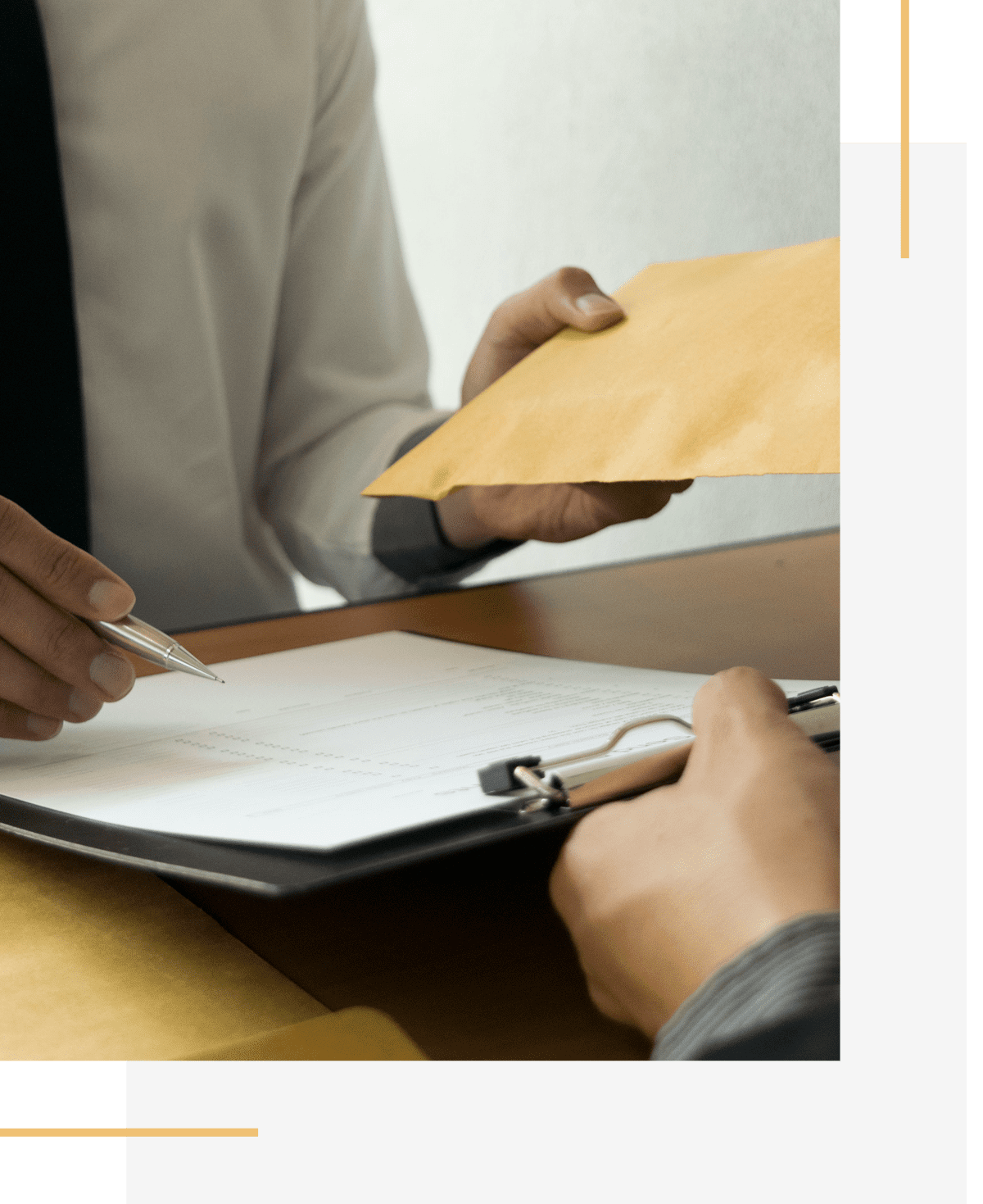 Handing over a manila envelope